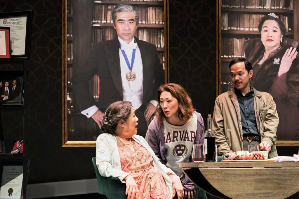 Three actors perform in the play “Tiger Style!” at South Coast Repertory.