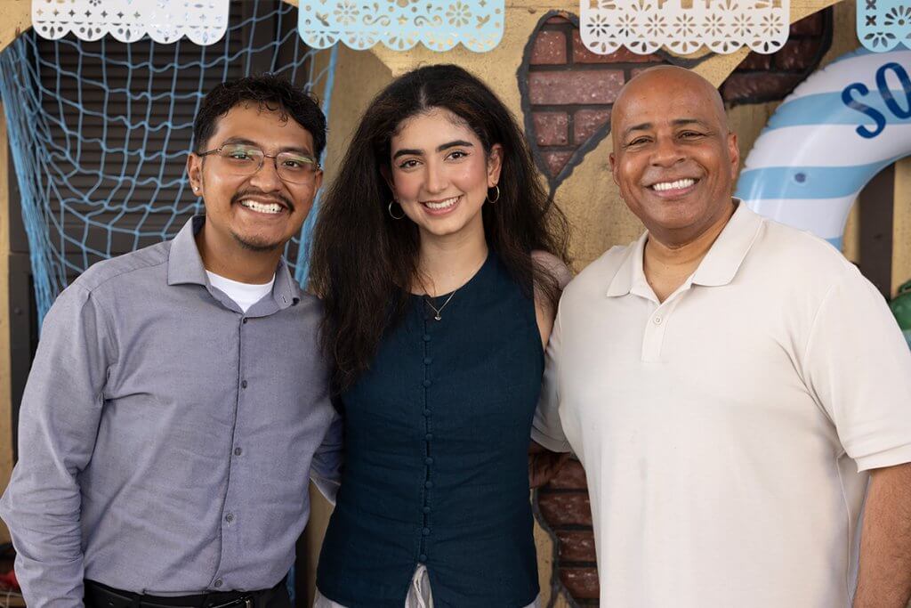 President Ronald Rochon poses for a photo with ASI student leaders at Celebración de CSUF: ¡Somos Titans!