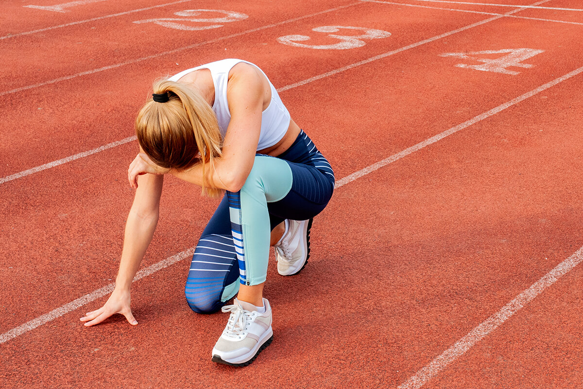 A runner rests at the end of a run.