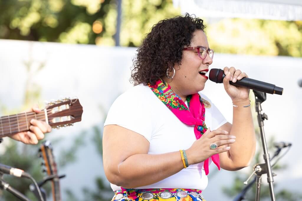 La Marisoul y Son California performs on stage. 
