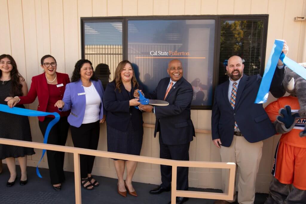 Cynthia Olivio and Ronald S. Rochon cut the dedication ribbon for the Future Titan Center.