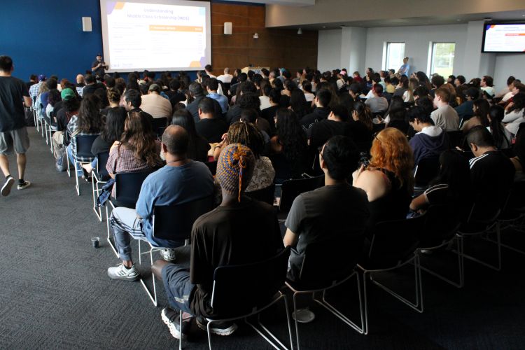 "Transfer Together" attendees listen to a presentation on admission requirements and next steps toward enrollment.