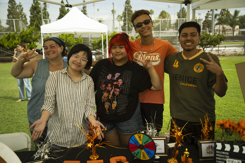Members of a student club stand behind their table at DiscoverFest